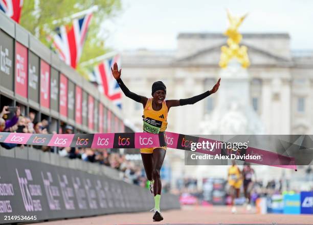Peres Jepchirchir of Kenya celebrates after winning the Women's elite race and setting a new world record during the 2024 TCS London Marathon at on...