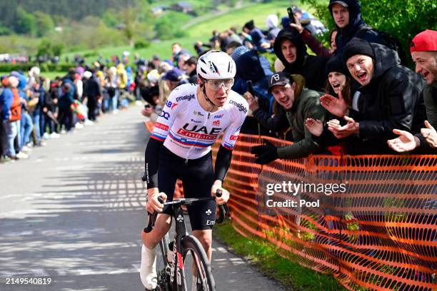 Tadej Pogacar of Slovenia and UAE Team Emirates attacks in the Côte de La Redoute while fans cheer during the 110th Liege - Bastogne - Liege 2024,...