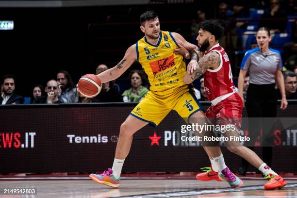 Alessandro Gentile of Givova Scafati Basket and Denzel Valentine of EA7 Emporio Armani Milan in action during the LBA Lega Basket Serie A Round 28...