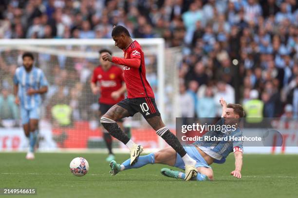 Marcus Rashford of Manchester United is challenged by Ben Sheaf of Coventry City during the Emirates FA Cup Semi Final match between Coventry City...