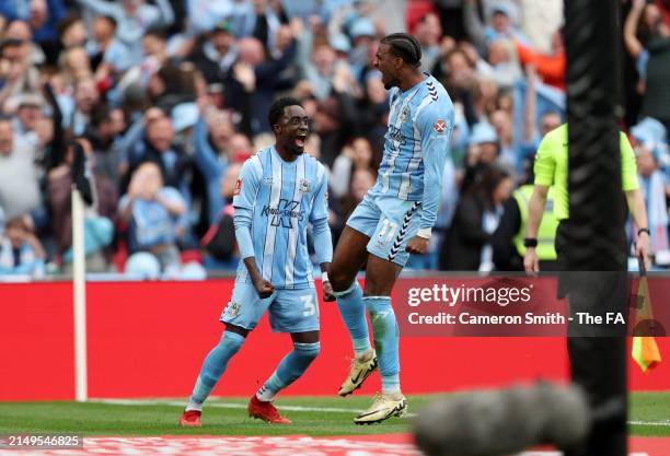 Haji Wright celebrates scoring his team's third goal from the penalty spot with Fabio Tavares of Coventry City during the Emirates FA Cup Semi Final...