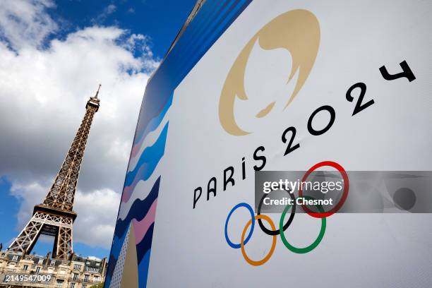 The Paris 2024 logo, representing the Olympic Games is displayed near the Eiffel Tower three months prior to the start of the Paris 2024 Olympic and...