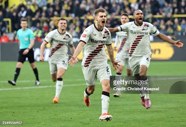 Josip Stanisic of Bayer Leverkusen celebrates scoring his team's first goal during the Bundesliga match between Borussia Dortmund and Bayer 04...