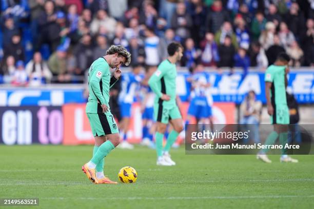 Antoine Griezmann of Atletico Madrid looks dejected after Luis Rioja of Deportivo Alaves scores his team's second goal during the LaLiga EA Sports...