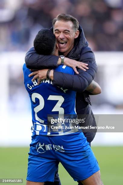 Luis Garcia, Head Coach of Deportivo Alaves, embraces Carlos Benavidez of Deportivo Alaves after the team's victory in the LaLiga EA Sports match...