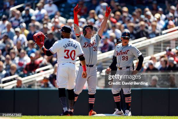 Kerry Carpenter of the Detroit Tigers celebrates his RBI single against the Minnesota Twins in the first inning at Target Field on April 21, 2024 in...