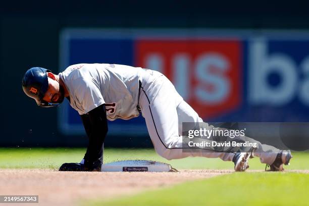 Riley Greene of the Detroit Tigers steals second base against the Minnesota Twins in the first inning at Target Field on April 21, 2024 in...