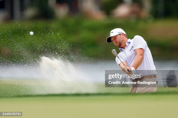Brice Garnett hits out of a greenside bunker on the fifth hole during the final round of the RBC Heritage at Harbour Town Golf Links on April 21,...