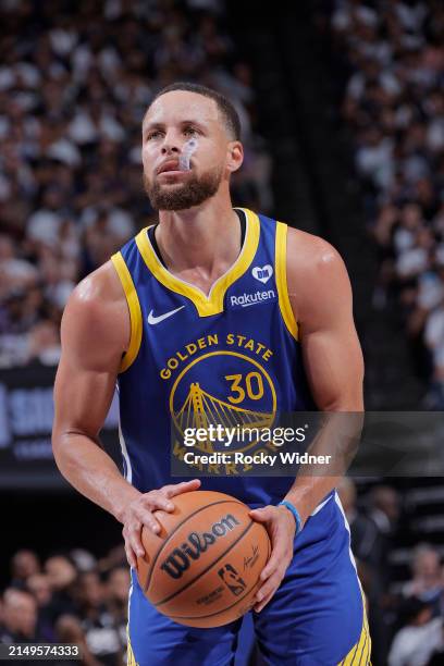Stephen Curry of the Golden State Warriors shoots a free throw during the game against the Sacramento Kings during the 2024 Play-In Tournament on...