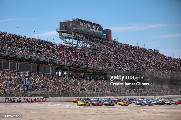 Michael McDowell, driver of the Love's Travel Stops Ford, leads the field to start the NASCAR Cup Series GEICO 500 at Talladega Superspeedway on...