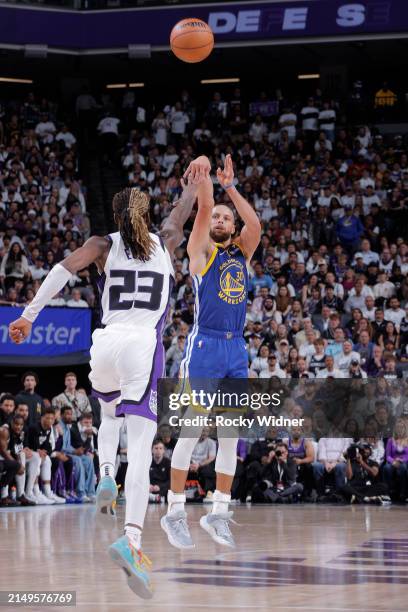 Stephen Curry of the Golden State Warriors shoots a three pointer during the game against the Sacramento Kings during the 2024 Play-In Tournament on...