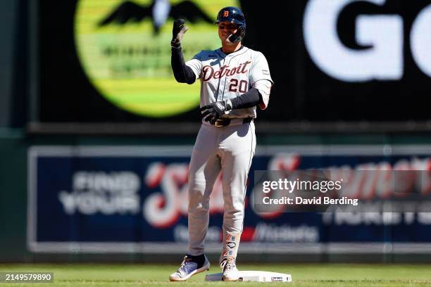 Spencer Torkelson of the Detroit Tigers celebrates his RBI double against the Minnesota Twins in the seventh inning at Target Field on April 21, 2024...