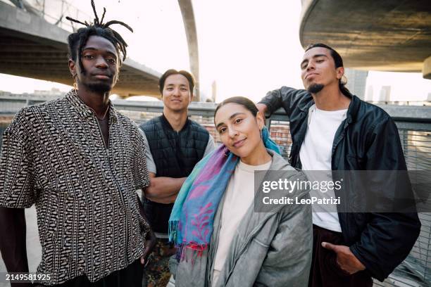 group of street hip hop breakdancers posing looking to camera - alternative lifestyle stock pictures, royalty-free photos & images