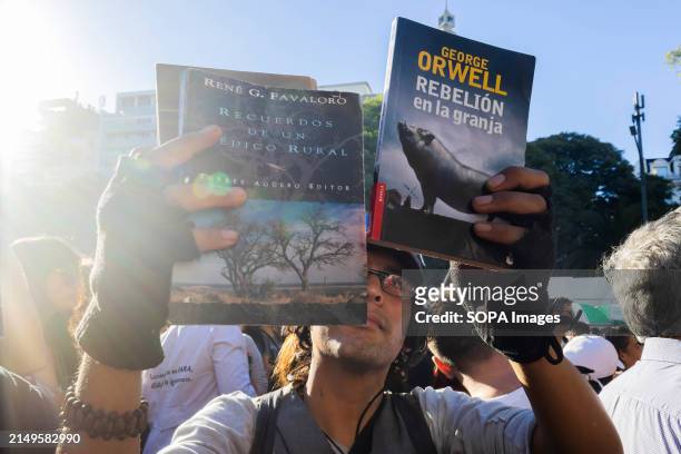Young demonstrator displays his books as a way of protesting according to the slogan proposed in the call for the march in defense of the public...
