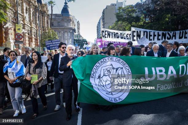 Professors, teachers and students of the law school lead one of the columns heading to Plaza de Mayo during the rally. Protesters in favor of public...