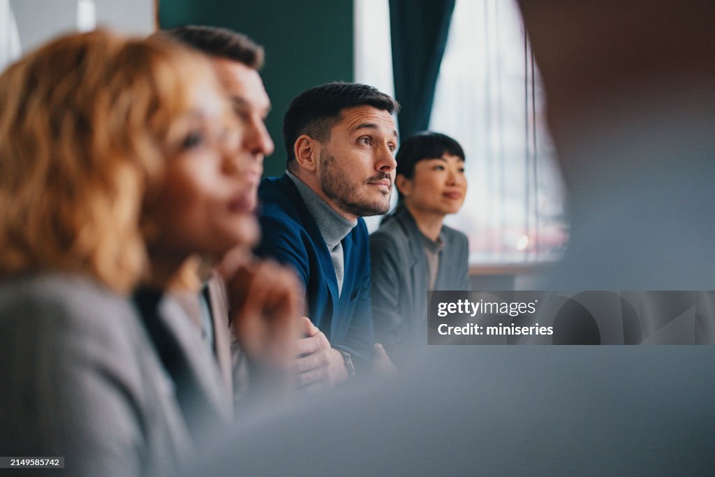 A Happy Handsome Businessman Working With His Team In The Office