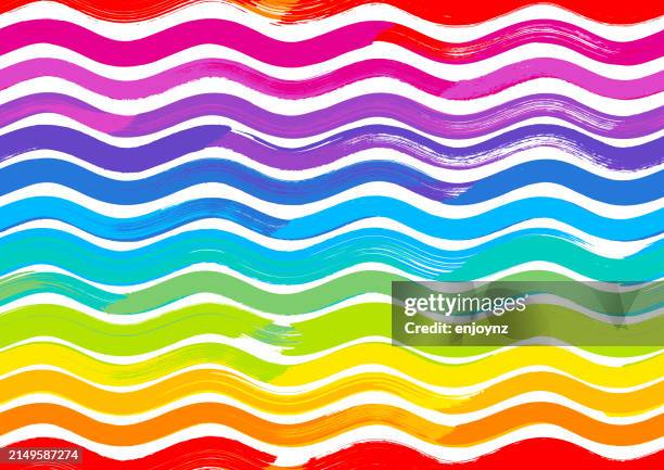 seamless rainbow wavy lines pride pattern background - pride flag background stock illustrations