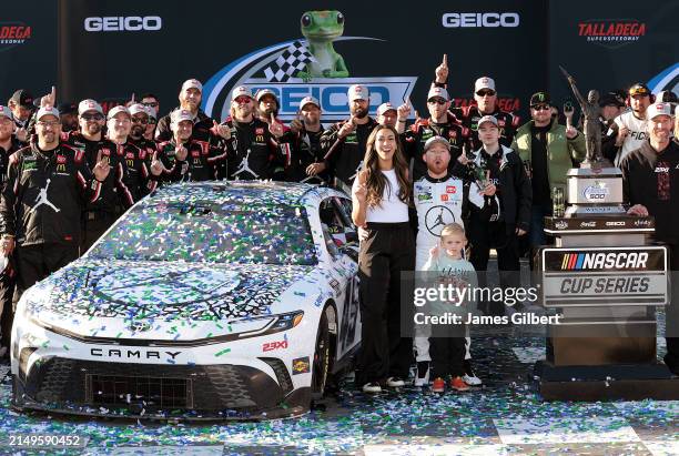 Tyler Reddick, driver of the Jordan Brand Toyota, celebrates with crew and family in victory lane after winning the NASCAR Cup Series GEICO 500 at...