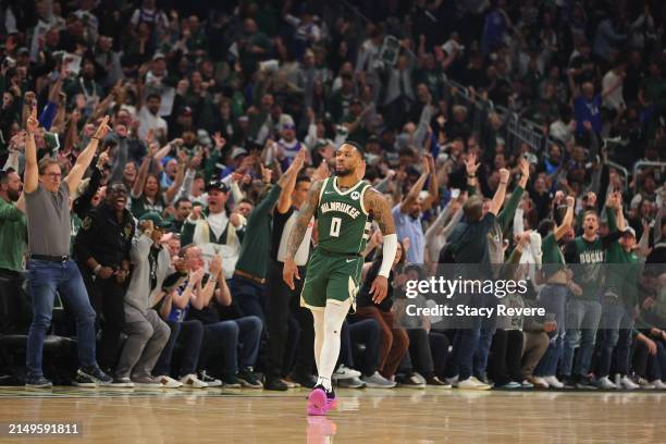 Damian Lillard of the Milwaukee Bucks reacts to a three point shot during the first half of game one of the Eastern Conference First Round Playoffs...