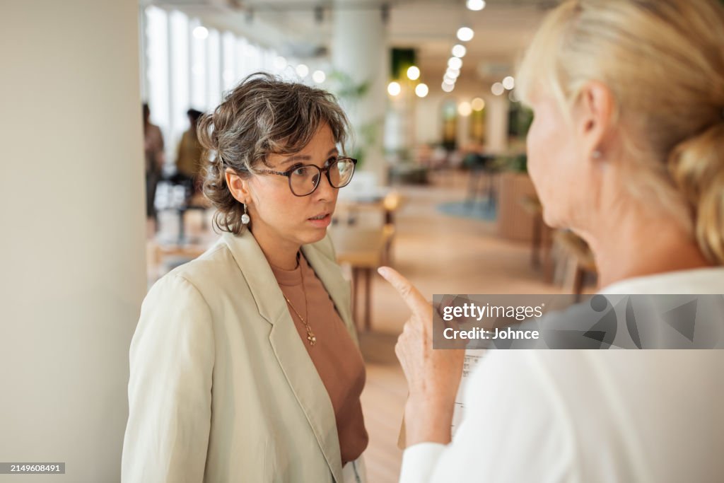 Businesswoman scolding her employee