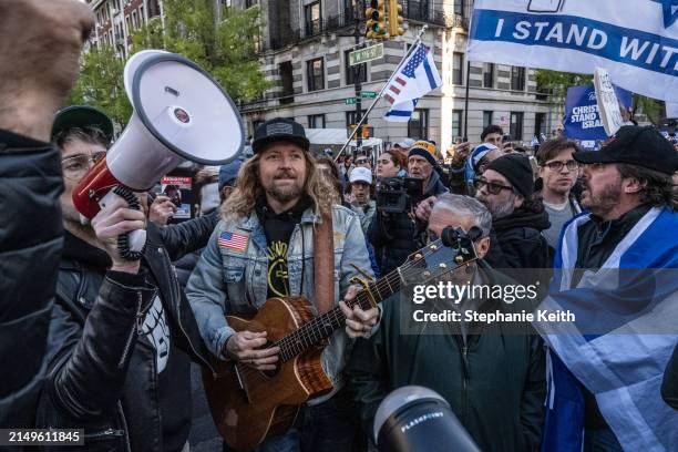 Israel supporters, including Christian evangelical Sean Feucht , participate in the United for Israel march outside of Columbia University on April...