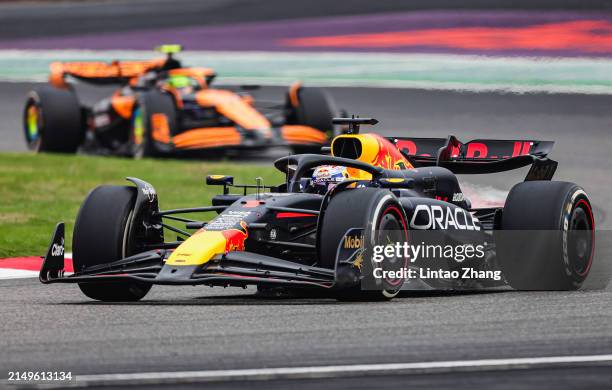 Max Verstappen of the Netherlands driving the Oracle Red Bull Racing RB20 leads Lando Norris of Great Britain driving the McLaren MCL38 Mercedes on...