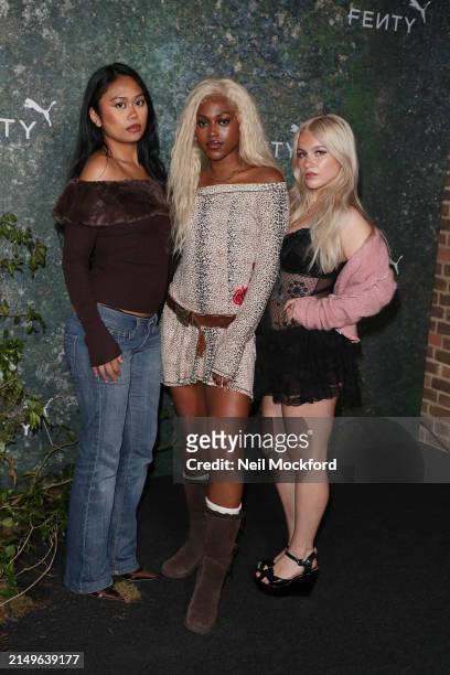 Ysabelle Salvanera, Amelia Onuorah, and Madeleine Haynes from Say Now attend the FENTY x PUMA Creeper Phatty Earth Tone Launch Party at Tobacco Dock...