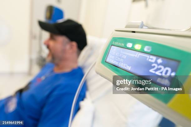 Patient Steve Young waits as infusion is administered, having received his first jab at the University College London Hospital in London, for an...