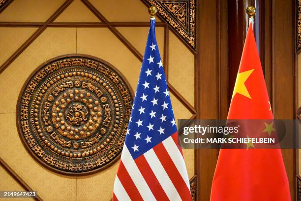 S and China's flags are seen at a room where US Secretary of State Antony Blinken meets with China's Minister of Public Security Wang Xiaohong at the...