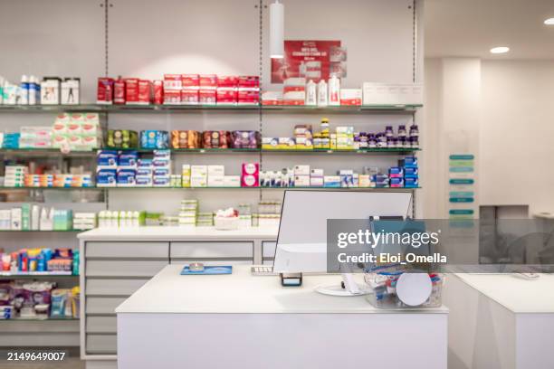 shelves with medicaments in pharmacy store - apotheek stockfoto's en -beelden