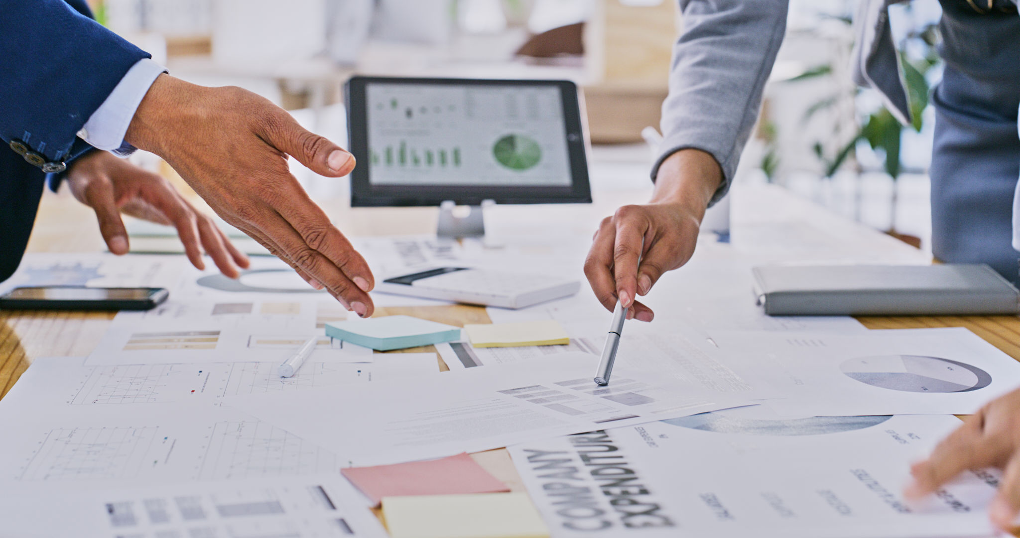 Business hands, teamwork and meeting for data analysis, budget report and company expenses on tablet screen. Professional group of people with documents, statistics and graphs or charts for finance Business hands, teamwork and meeting for data analysis, budget report and company expenses on tablet screen. Professional group of people with documents, statistics and graphs or charts for finance