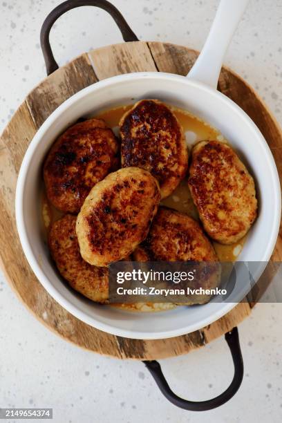 chicken cutlets in a frying pan - cutlet stock pictures, royalty-free photos & images