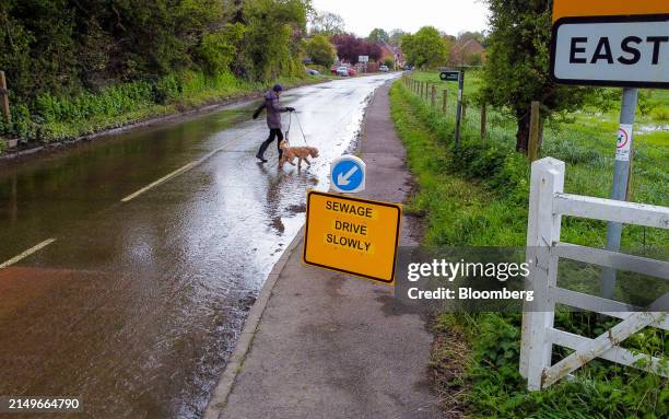 Surface water and sewage on the road at the entrance to the village East Ilsley, UK, on Wednesday, April. 24, 2024. Thames Water needs to spend £19.8...