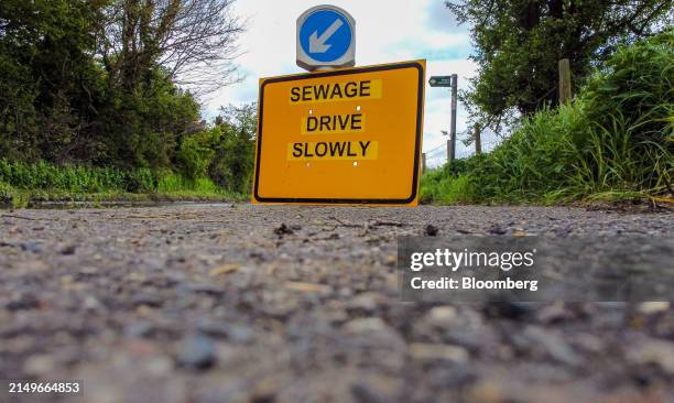 Surface water and sewage on the road at the entrance to the village East Ilsley, UK, on Wednesday, April. 24, 2024. Thames Water needs to spend £19.8...