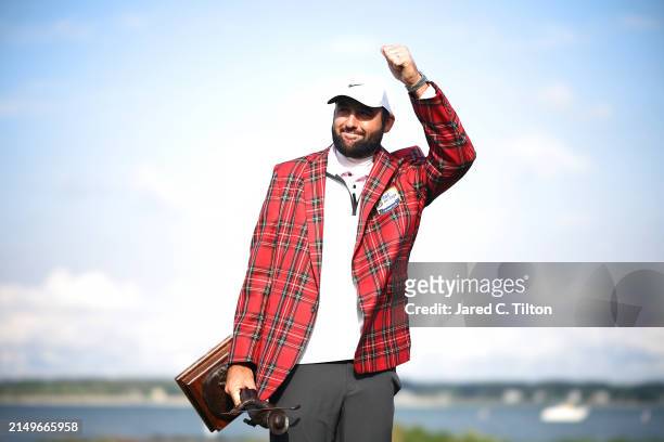 Scottie Scheffler of the United States celebrates with the trophy and the tartan jacket after winning during the continuation of the final round of...