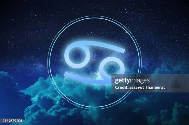 zodiac cancer symbol on a colorful background light - moon crabs stock pictures, royalty-free photos & images