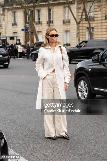 Claire Rose Cliteur wears all Miu Miu with Saint Laurent sunglasses outside the Miu Miu show during the Womenswear Fall/Winter 2024/2025 as part of...
