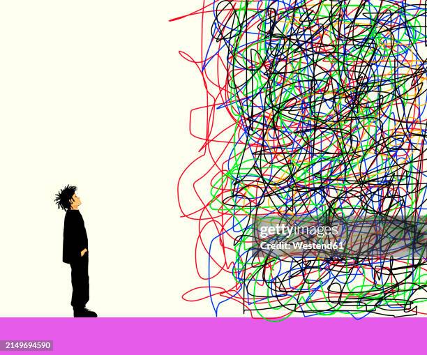 confused boy looking at tangled lines against colored background - verheddert stock-grafiken, -clipart, -cartoons und -symbole