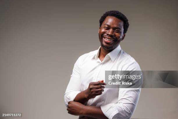 portrait of a man in a white shirt - black shirt stock pictures, royalty-free photos & images