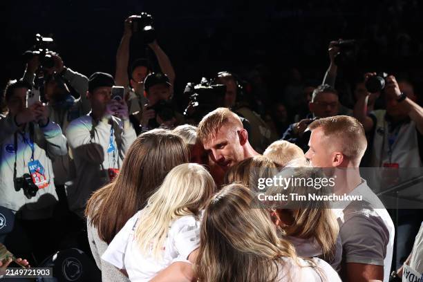 Kyle Dake reacts with family after defeating Jason Nolf to win the men's freestyle 74-KG division final during the US Olympic Wrestling Trials held...