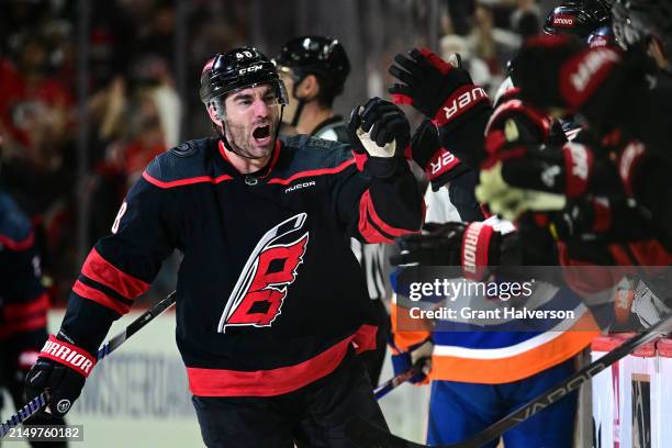 Jordan Martinook of the Carolina Hurricanes celebates scoring the game-winning goal against the New York Islanders in the third period of Game Two of...