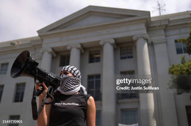 Pro-Palestinian protester uses a bullhorn during a demonstration in front of Sproul Hall on the UC Berkeley campus on April 22, 2024 in Berkeley,...
