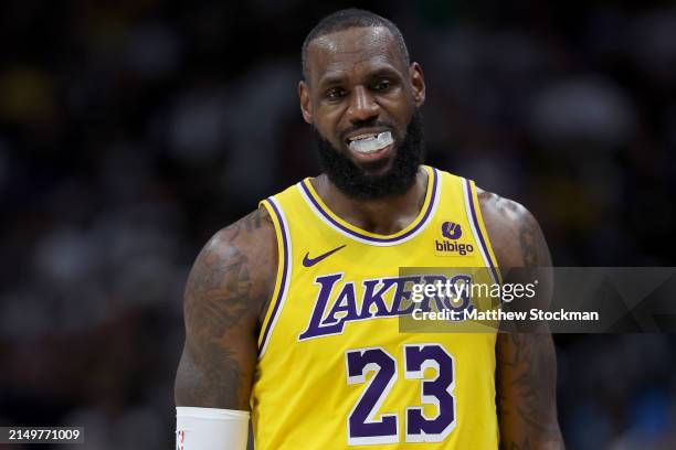 LeBron James of the Los Angeles Lakers walks back to his bench while playing the Denver Nuggets in the fourth quarter during game two of the Western...