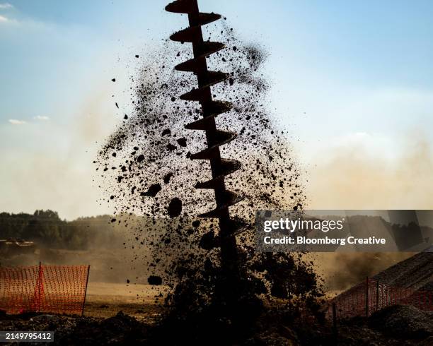 a drill breaks into the ground - broca imagens e fotografias de stock
