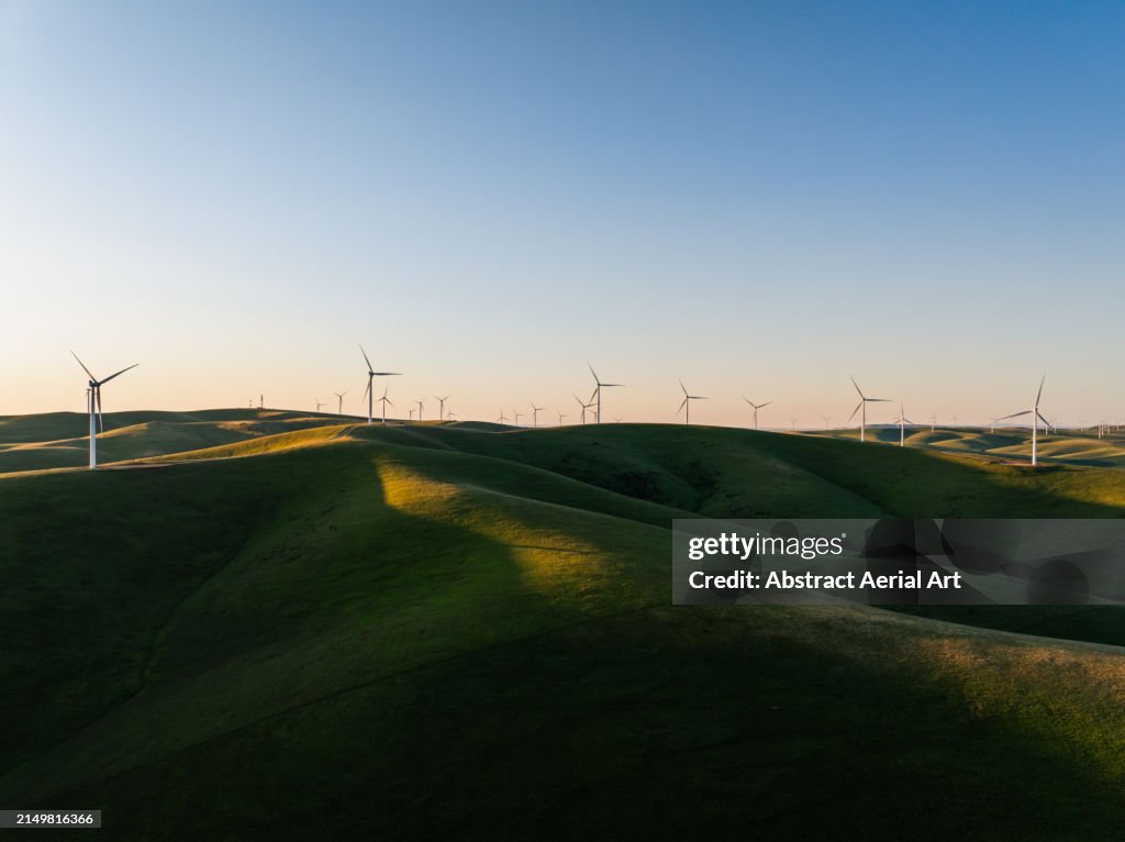 Wind turbines on a sunny afternoon shot from an aerial perspective, South Australia, Australia
