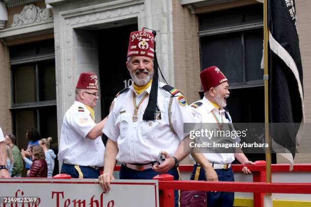 shriners at the 75th annual nato parade in norfolk, virginia. - colored shriners fotografías e imágenes de stock