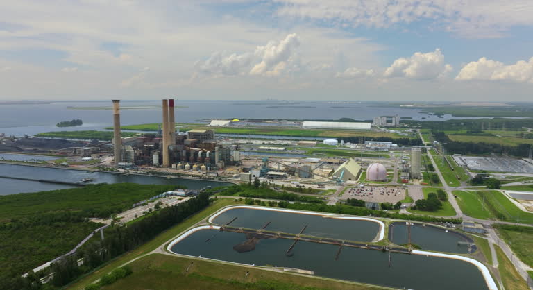https://media.gettyimages.com/id/2149823962/video/view-from-above-of-large-thermal-big-bend-power-plant-in-apollo-beach-near-tampa-florida-coal.jpg?b=1&s=640x640&k=20&c=lMZOXSyz7uijQyn-GMA5IEvKyclWHNG0lIIDuX_mfaI=
