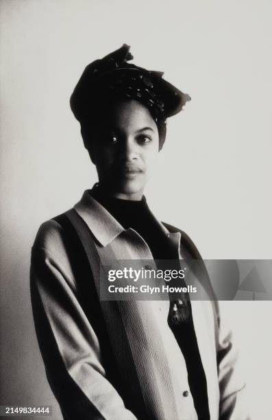 Woman is posed wearing a 'yardie' cardigan and headband, circa 1992.