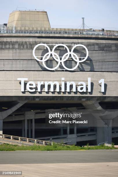 Olympic rings on the Roissy - Charles de Gaulle Airport terminal 1 are unveiled at Airport Roissy Charles de Gaulle on April 23, 2024 in Paris,...