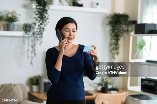 discussing insurance details on phone - id verification stock pictures, royalty-free photos & images